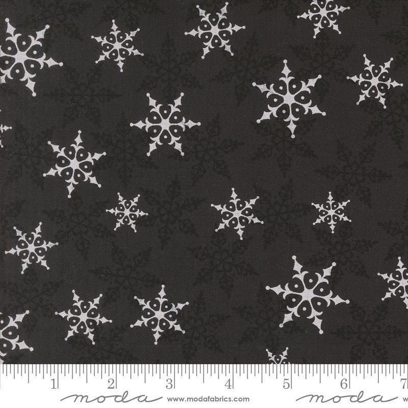 Image of the Winter Friends Woodland Charcoal Black quilting cotton fabric by Moda Fabrics. Features snowflakes on a black background. Cute Little Fabric Shop