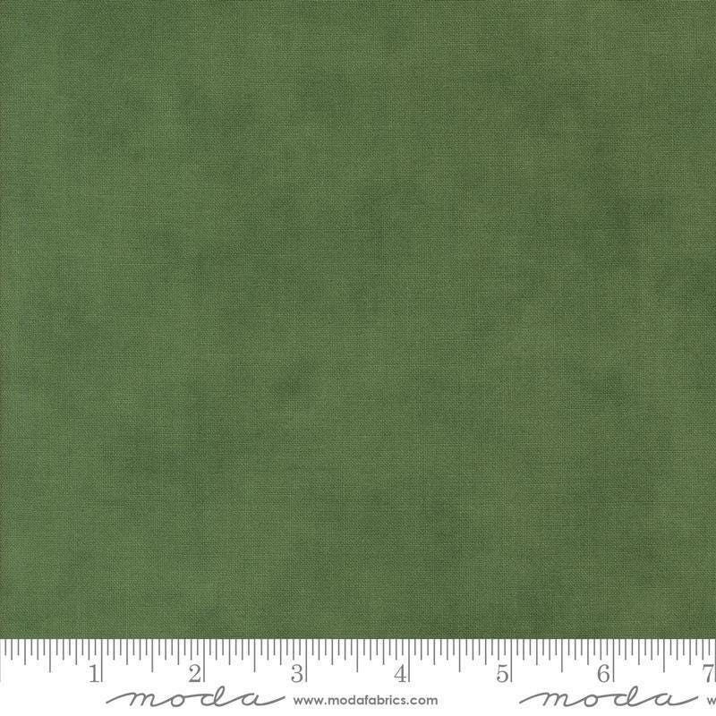 Image of the Winter Friends Solid Spruce quilting cotton fabric by Moda Fabrics. Features texture on a green background. Cute Little Fabric Shop