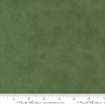 Image of the Winter Friends Solid Spruce quilting cotton fabric by Moda Fabrics. Features texture on a green background. Cute Little Fabric Shop