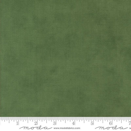 Image of the Winter Friends Solid Spruce quilting cotton fabric by Moda Fabrics. Features texture on a green background. Cute Little Fabric Shop