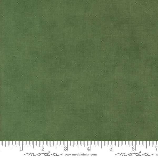 Image of the Winter Friends Solid Spruce quilting cotton fabric by Moda Fabrics. Features texture on a green background. Cute Little Fabric Shop