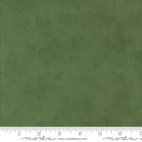 Image of the Winter Friends Solid Spruce quilting cotton fabric by Moda Fabrics. Features texture on a green background. Cute Little Fabric Shop