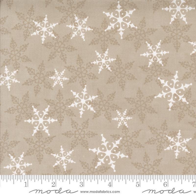 Image of the Winter Friends Woodland Fog quilting cotton fabric by Moda Fabrics. Features snowflakes on a tan background. Cute Little Fabric Shop