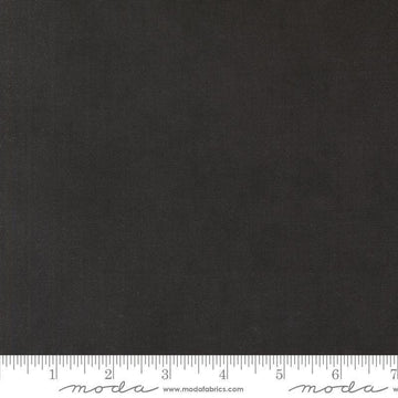 Image of the Winter Friends Solid Charcoal Black quilting cotton fabric by Moda Fabrics. Features texture on a black background. Cute Little Fabric Shop