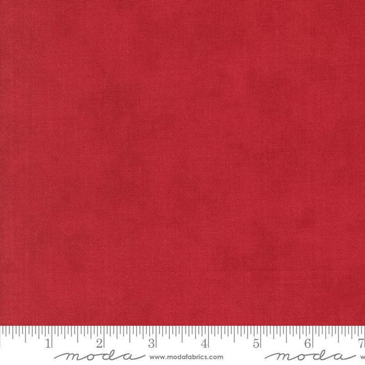 Image of the Winter Friends Solid Berry Red quilting cotton fabric by Moda Fabrics. Features texture on a red background. Cute Little Fabric Shop