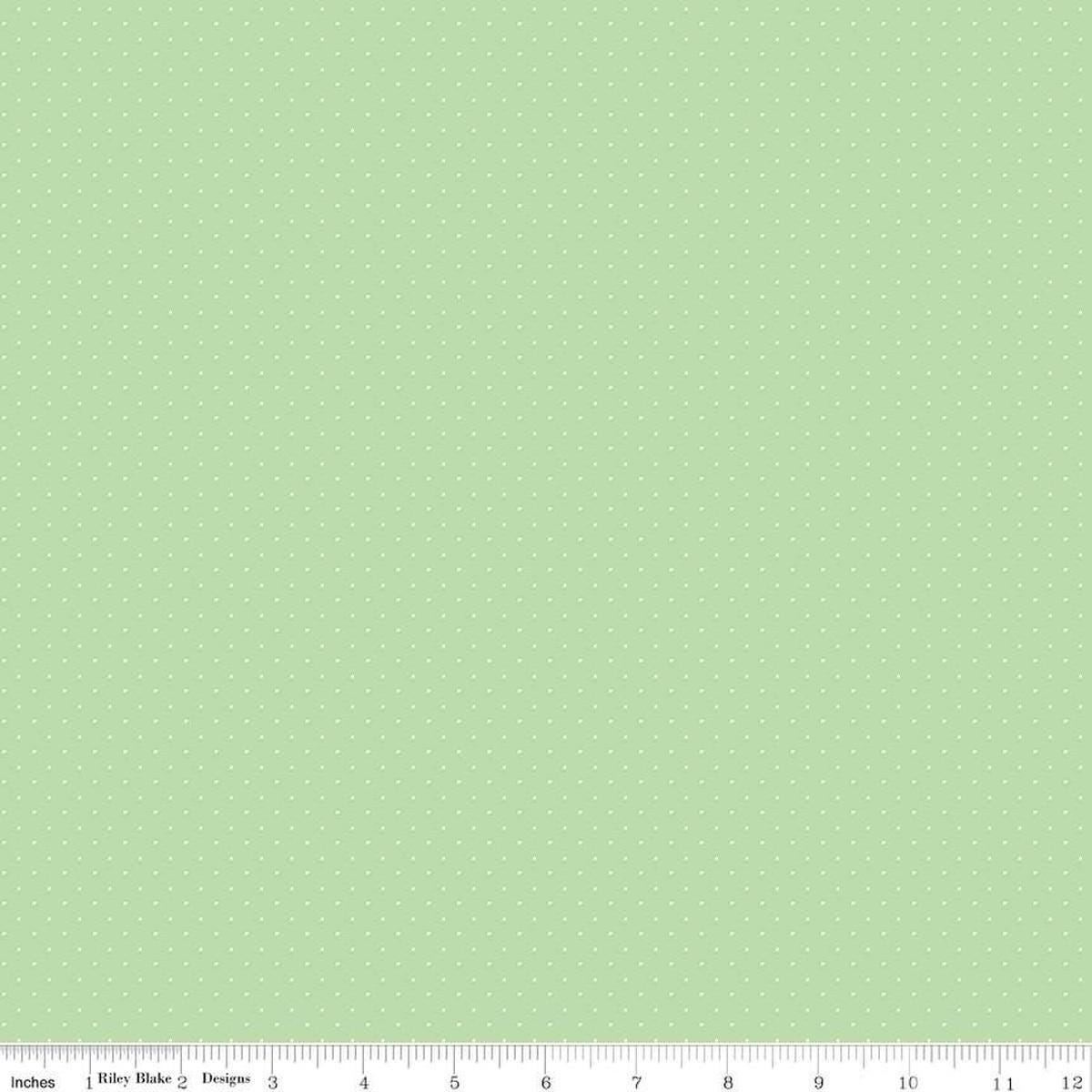 Image of the American Jane Pindots Sage quilting cotton fabric by American Jane for Riley Blake Designs. Features tiny dots on a green background. Cute Little Fabric Shop