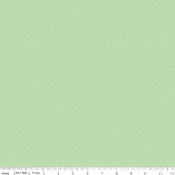 Image of the American Jane Pindots Sage quilting cotton fabric by American Jane for Riley Blake Designs. Features tiny dots on a green background. Cute Little Fabric Shop