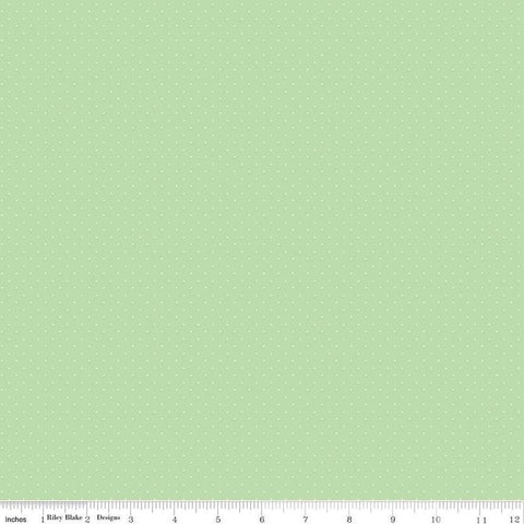 Image of the American Jane Pindots Sage quilting cotton fabric by American Jane for Riley Blake Designs. Features tiny dots on a green background. Cute Little Fabric Shop
