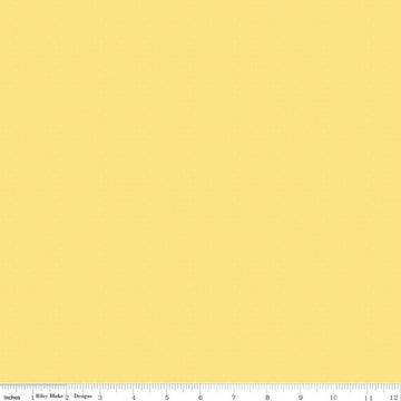 Image of the American Jane Pindots Canary quilting cotton fabric by American Jane for Riley Blake Designs. Features tiny dots on a yellow background. Cute Little Fabric Shop