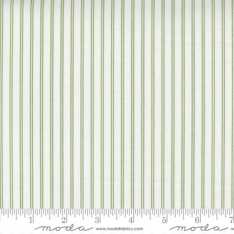 Image of the Nantucket Summer Stripes Cream Grass quilting cotton fabric by Camille Roskelley for Moda Fabrics. Features stripes on a green background. Cute Little Fabric Shop