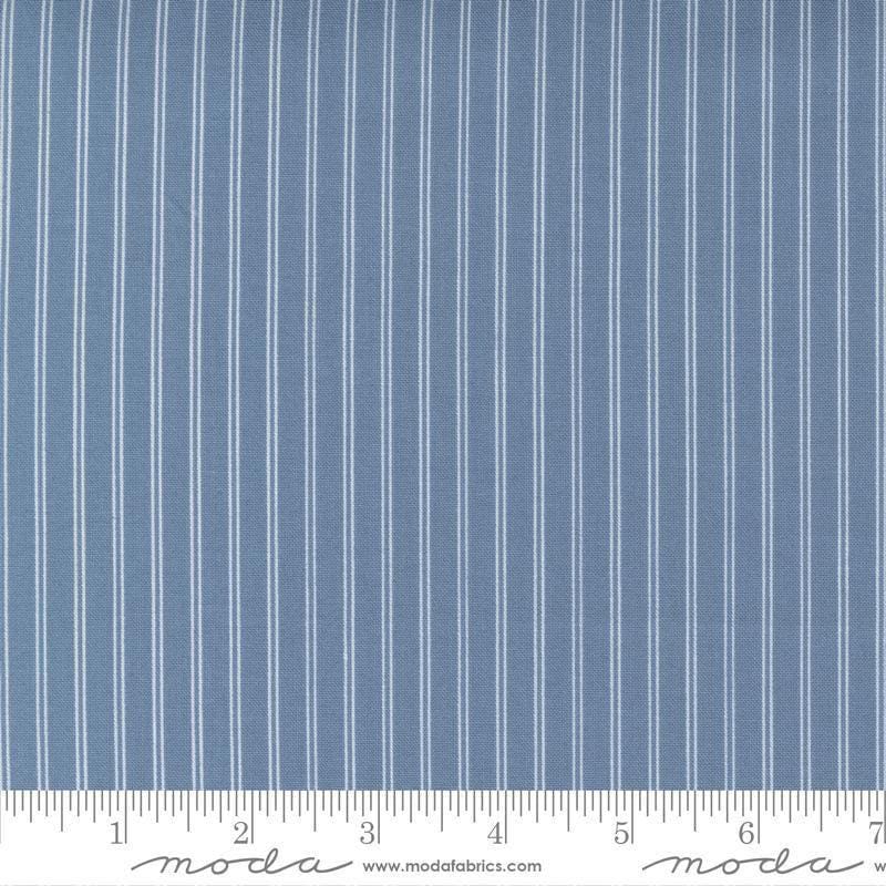 Image of the Nantucket Summer Stripes Lake quilting cotton fabric by Camille Roskelley for Moda Fabrics. Features stripes on a blue background. Cute Little Fabric Shop