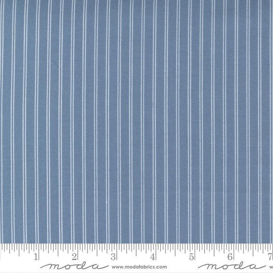 Image of the Nantucket Summer Stripes Lake quilting cotton fabric by Camille Roskelley for Moda Fabrics. Features stripes on a blue background. Cute Little Fabric Shop