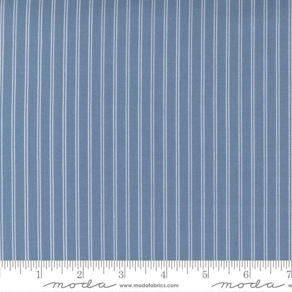 Image of the Nantucket Summer Stripes Lake quilting cotton fabric by Camille Roskelley for Moda Fabrics. Features stripes on a blue background. Cute Little Fabric Shop