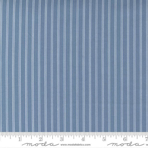 Image of the Nantucket Summer Stripes Lake quilting cotton fabric by Camille Roskelley for Moda Fabrics. Features stripes on a blue background. Cute Little Fabric Shop