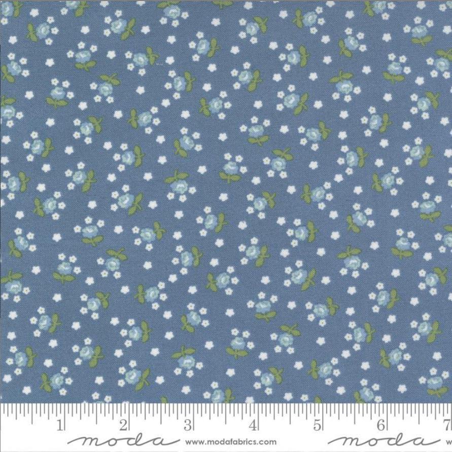 Image of the Nantucket Summer Fairground Lake quilting cotton fabric by Camille Roskelley for Moda Fabrics. Features florals on a blue background. Cute Little Fabric Shop