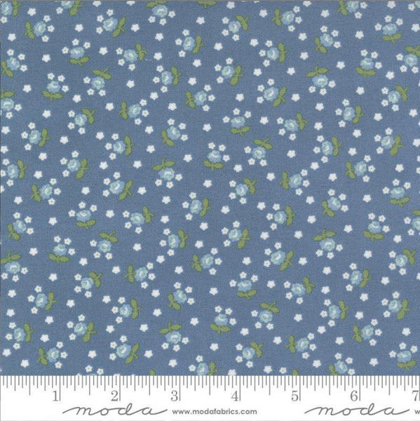 Image of the Nantucket Summer Fairground Lake quilting cotton fabric by Camille Roskelley for Moda Fabrics. Features florals on a blue background. Cute Little Fabric Shop