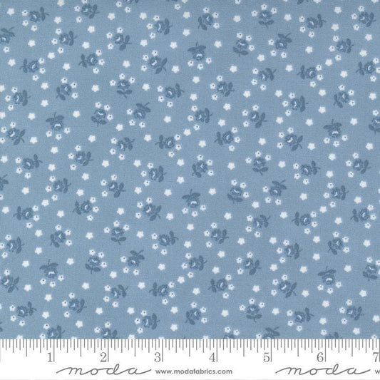 Image of the Nantucket Summer Fairground Light Blue quilting cotton fabric by Camille Roskelley for Moda Fabrics. Features florals on a blue background. Cute Little Fabric Shop