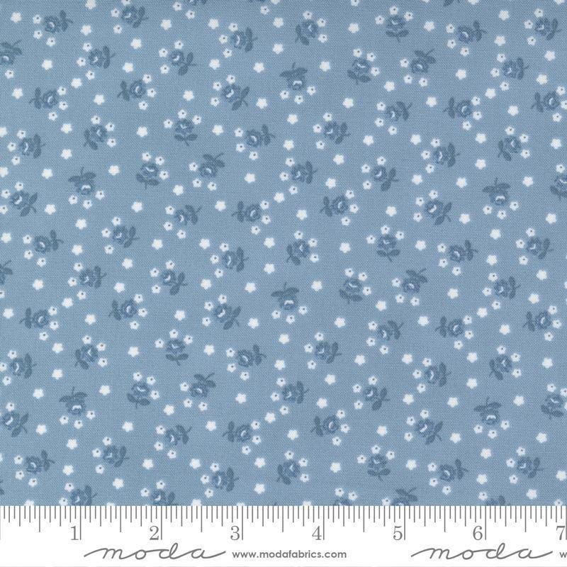 Image of the Nantucket Summer Fairground Light Blue quilting cotton fabric by Camille Roskelley for Moda Fabrics. Features florals on a blue background. Cute Little Fabric Shop