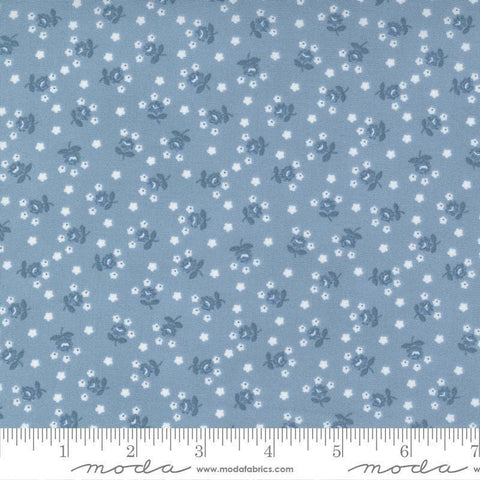 Image of the Nantucket Summer Fairground Light Blue quilting cotton fabric by Camille Roskelley for Moda Fabrics. Features florals on a blue background. Cute Little Fabric Shop