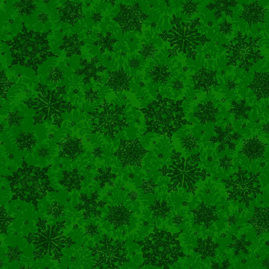 Image of the Poinsettia Greetings Poinsettia Tonal forest quilting cotton fabric by QT Fabrics. Features snowflakes on a green background. Cute Little Fabric Shop