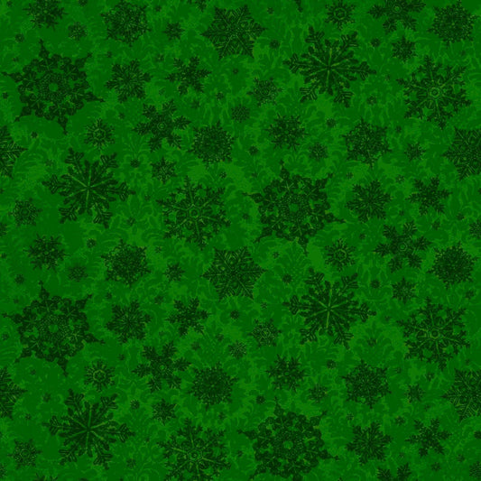 Image of the Poinsettia Greetings Poinsettia Tonal forest quilting cotton fabric by QT Fabrics. Features snowflakes on a green background. Cute Little Fabric Shop