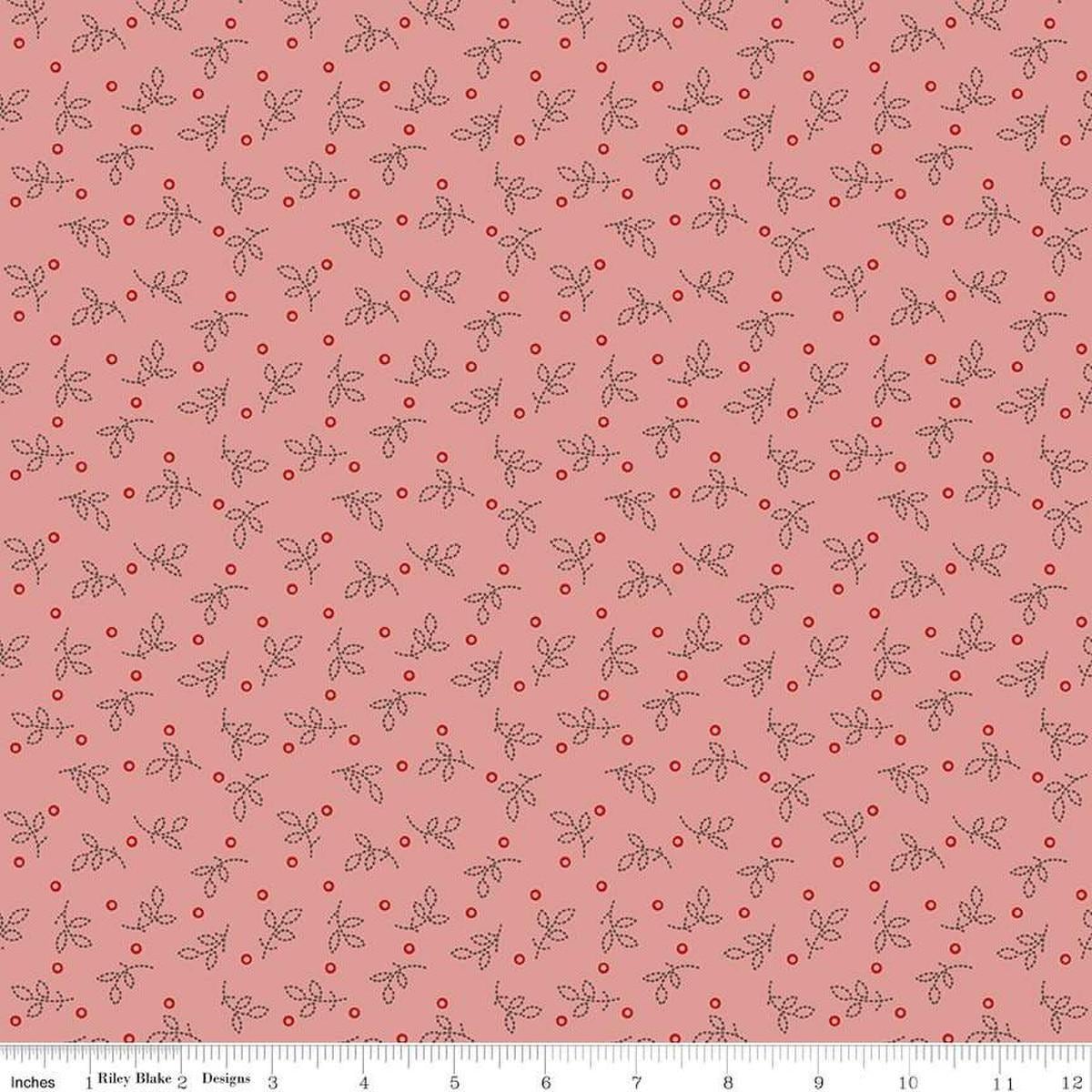Image of the Gentler Times Pleasant Coral quilting cotton fabric by Riley Blake Designs. Features dots on a pink background. Cute Little Fabric Shop