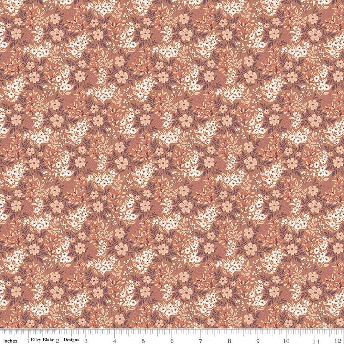 Image of the Evening on the Prairie Ditsy Floral Umber quilting cotton fabric by Modern Prairie for Riley Blake Designs. Features flowers on an orange background. Cute Little Fabric Shop