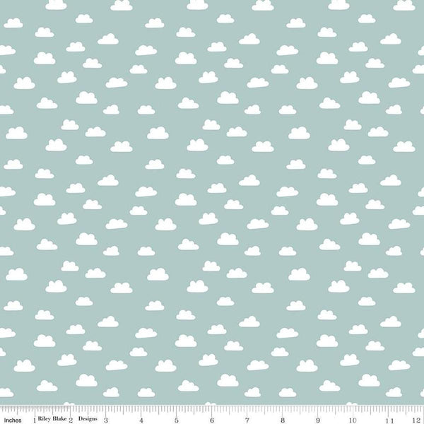 Image of the Baby Boy Clouds Blue quilting cotton fabric by Lori Whitlock for Riley Blake Designs. Features clouds on a blue background. Cute Little Fabric Shop