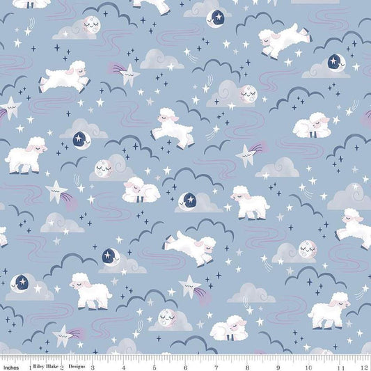 Image of the Twinkle Little Star Main Blue quilting cotton fabric by Riley Blake Designs. Features sheep on a blue background. Cute Little Fabric Shop