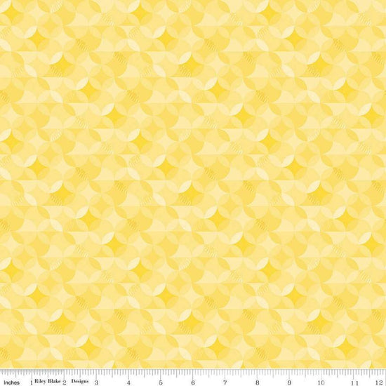 Image of the New Box of Crayons Kaleidoscope Yellow Quilting Cotton Fabric by Riley Blake Designs. Features orange peel on a yellow background. Cute Little Fabric Shop