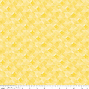 Image of the New Box of Crayons Kaleidoscope Yellow Quilting Cotton Fabric by Riley Blake Designs. Features orange peel on a yellow background. Cute Little Fabric Shop