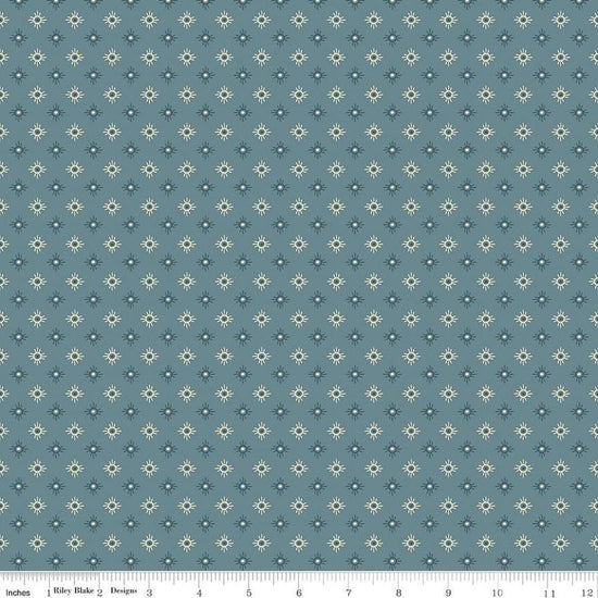 Image of John Wayne American West Sun Denim quilting cotton fabric by Riley Blake Official Product for Riley Blake Designs. Features suns on a blue background. Cute Little Fabric Shop