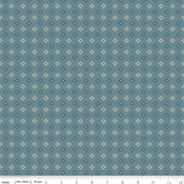 Image of John Wayne American West Sun Denim quilting cotton fabric by Riley Blake Official Product for Riley Blake Designs. Features suns on a blue background. Cute Little Fabric Shop