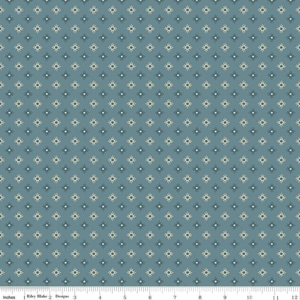 Image of John Wayne American West Sun Denim quilting cotton fabric by Riley Blake Official Product for Riley Blake Designs. Features suns on a blue background. Cute Little Fabric Shop