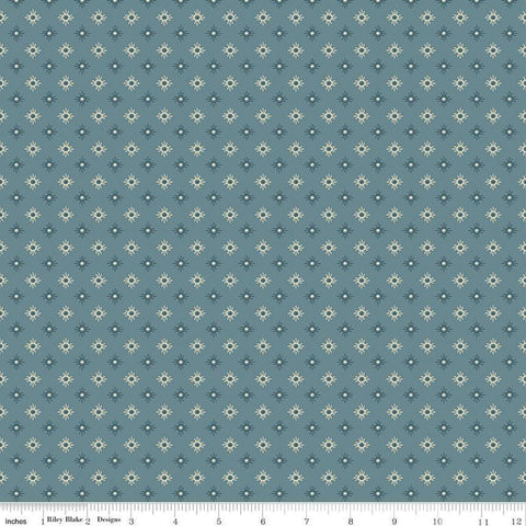 Image of John Wayne American West Sun Denim quilting cotton fabric by Riley Blake Official Product for Riley Blake Designs. Features suns on a blue background. Cute Little Fabric Shop
