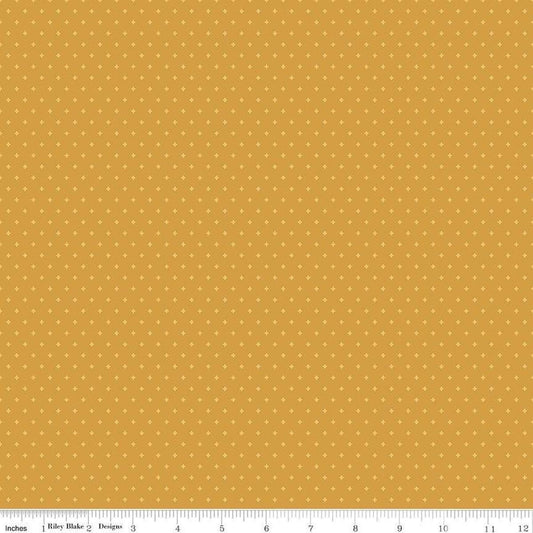Image of Essence Foils Golden quilting cotton fabric by Fran Gulick for Riley Blake Designs. Features stars on a yellow background. Cute Little Fabric Shop