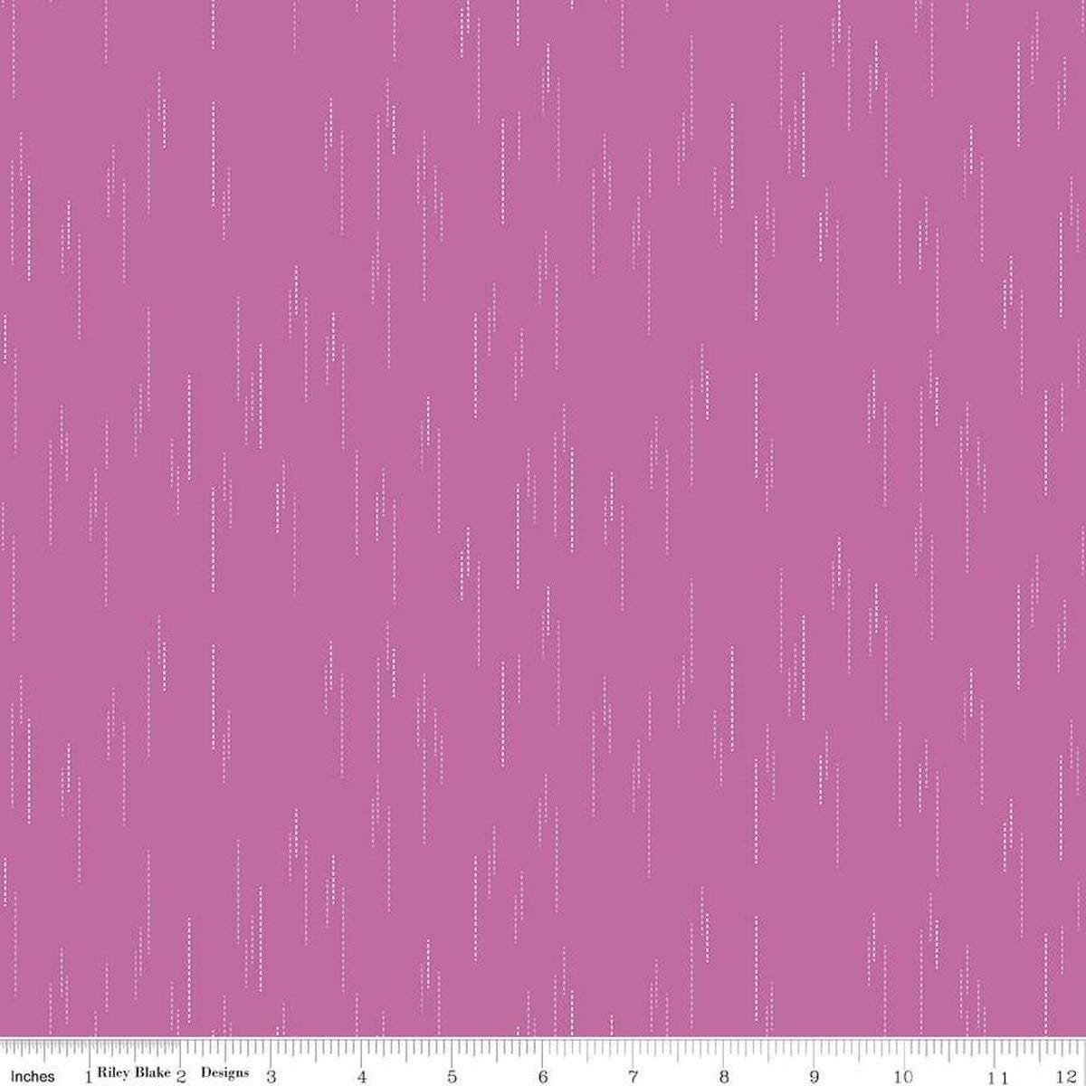 Image of Essence Raindrops Fuchsia quilting cotton fabric by Fran Gulick for Riley Blake Designs. Features rain on a purple background. Cute Little Fabric Shop