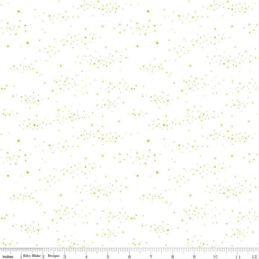 Image of Essence Starlight Gold quilting cotton fabric by Fran Gulick for Riley Blake Designs. Features stars on a white background. Cute Little Fabric Shop