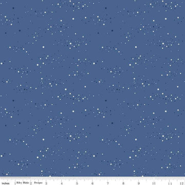 Image of Essence Starlight Denim quilting cotton fabric by Fran Gulick for Riley Blake Designs. Features stars on a blue background. Cute Little Fabric Shop