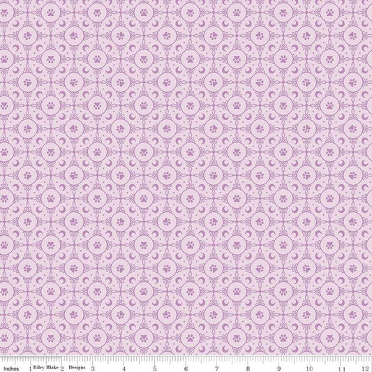 Image of Celtic Cats Circle Paws Lilac quilting cotton fabric by Brigid Ashwood for Riley Blake Designs. Features pawprints on a purple background. Cute Little Fabric Shop