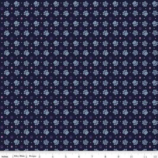 Image of Celtic Cats Paws Nighttime quilting cotton fabric by Brigid Ashwood for Riley Blake Designs. Features pawprints on a black background. Cute Little Fabric Shop