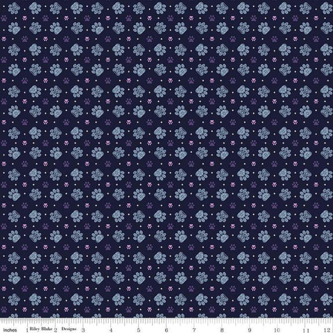 Image of Celtic Cats Paws Nighttime quilting cotton fabric by Brigid Ashwood for Riley Blake Designs. Features pawprints on a black background. Cute Little Fabric Shop