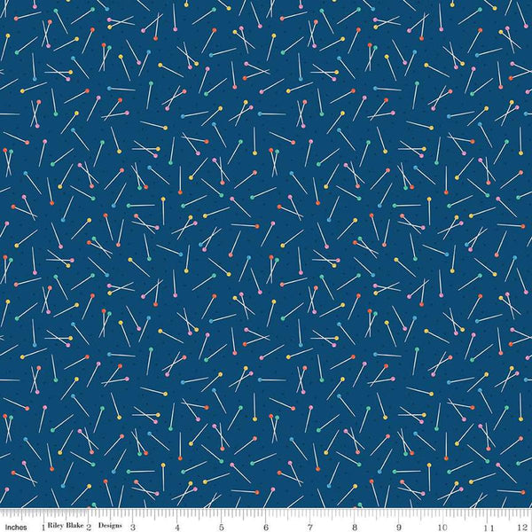 Image of Hand Made Pins Navy quilting cotton fabric by Amber Kemp-Gerstel for Riley Blake Designs. Features pins on a blue background. Cute Little Fabric Shop