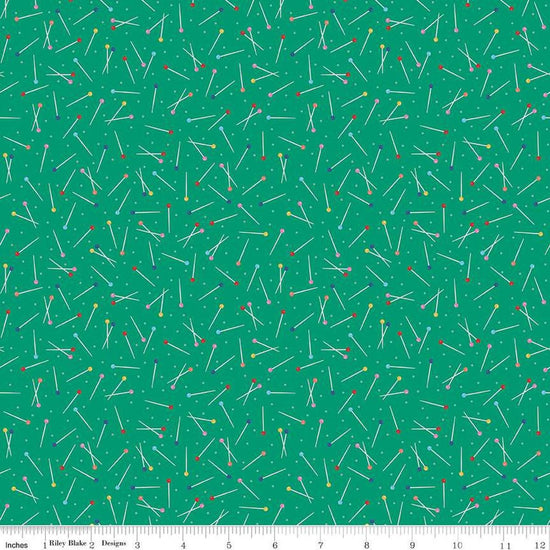 Image of Hand Made Pins Green quilting cotton fabric by Amber Kemp-Gerstel for Riley Blake Designs. Features pins on a green background. Cute Little Fabric Shop