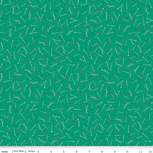 Image of Hand Made Pins Green quilting cotton fabric by Amber Kemp-Gerstel for Riley Blake Designs. Features pins on a green background. Cute Little Fabric Shop