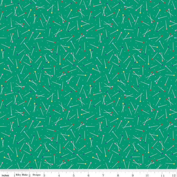 Image of Hand Made Pins Green quilting cotton fabric by Amber Kemp-Gerstel for Riley Blake Designs. Features pins on a green background. Cute Little Fabric Shop