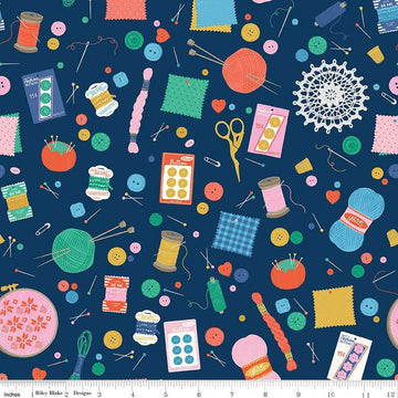 Image of Hand Made Notions Navy quilting cotton fabric by Amber Kemp-Gerstel for Riley Blake Designs. Features sewing supplies on a blue background. Cute Little Fabric Shop