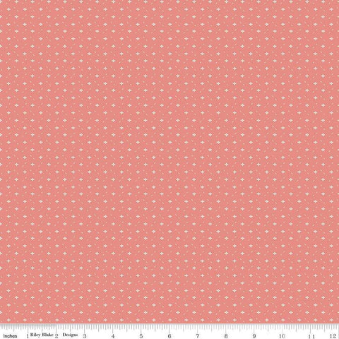 Image of Ivy Reese Ditsy Coral quilting cotton fabric by Deena Rutter for Riley Blake Designs. Features small shapes on a pink background. Cute Little Fabric Shop