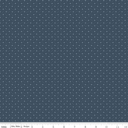 Image of Ivy Reese Ditsy Navy quilting cotton fabric by Deena Rutter for Riley Blake Designs. Features small shapes on a blue background. Cute Little Fabric Shop