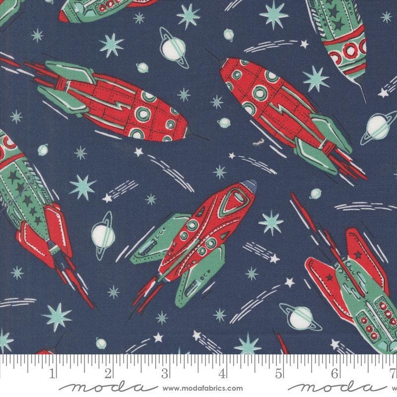 Image of the 321 Blast Off Rockets Galaxy quilting cotton fabric by Moda Fabrics. Features vintage spaceships on a blue background. Cute Little Fabric Shop